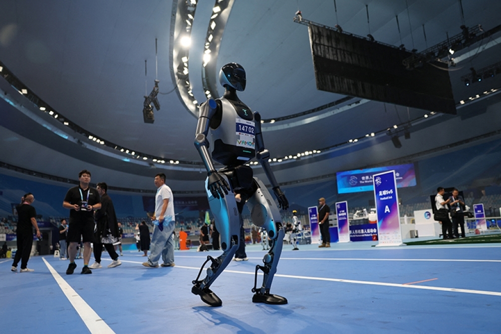 БНХАУ-ын Бээжин хотод Робот тамирчдын анхны тэмцээн үргэлжилж байна